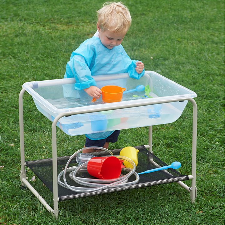 Folding stand and tray used in an outdoor setting filled with water